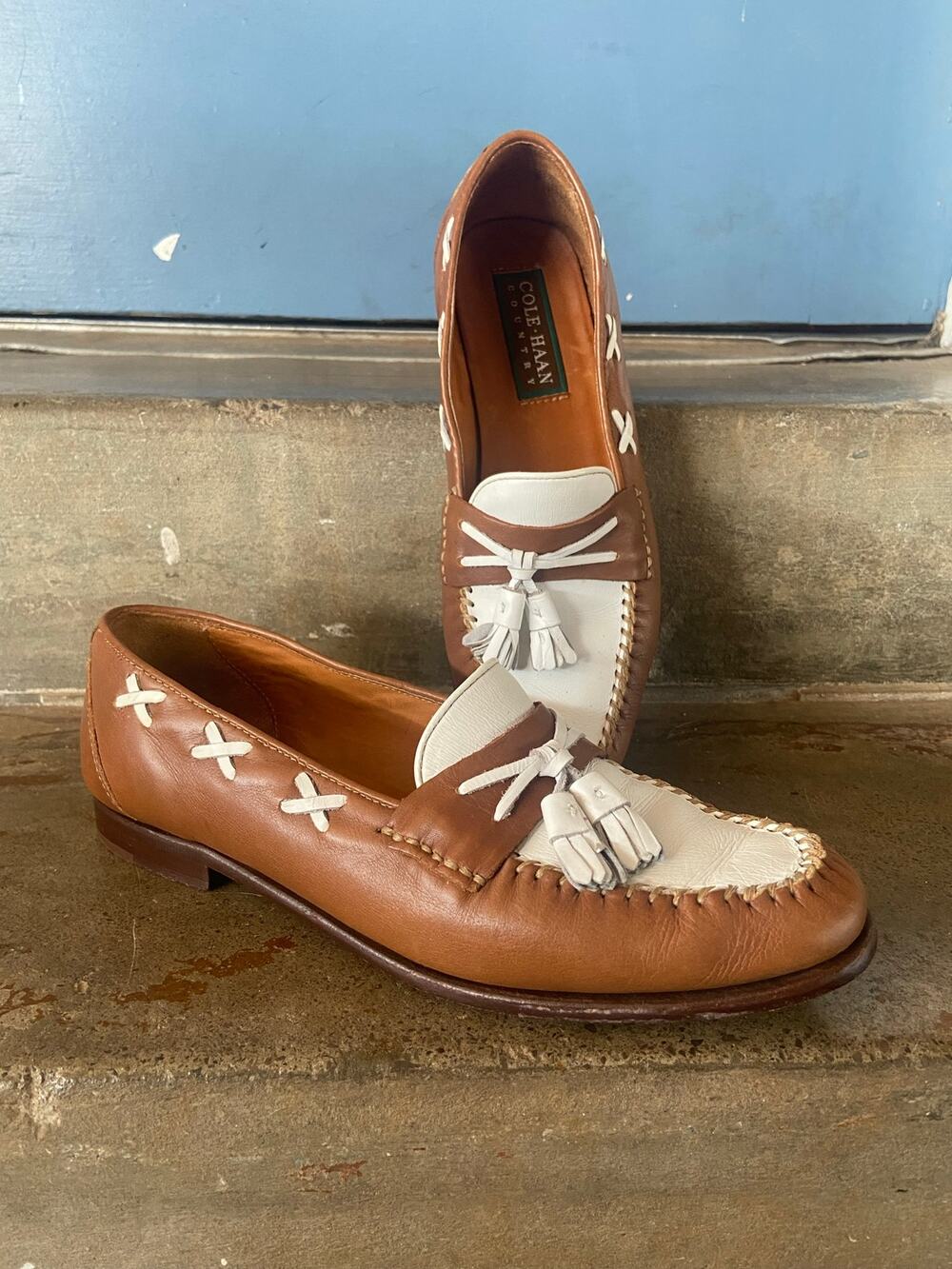 Cole Haan Country tan/white spectator leather slip on loafers with tassel detail